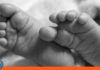 Niño asfixia semilla de mamón