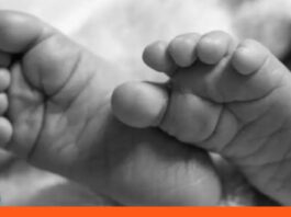 Niño asfixia semilla de mamón